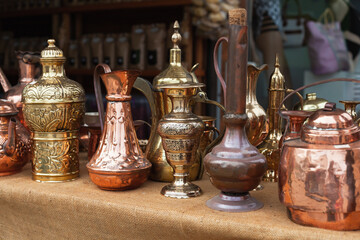 Fototapeta na wymiar Assortment of an Oriental copper dishware