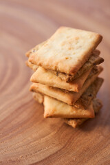 Wheat dry biscuits with spices on a wooden table