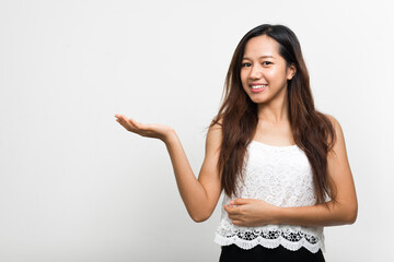 Portrait of happy young beautiful Asian woman