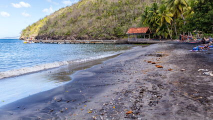 Fototapeta na wymiar Black sand beach in the Anses d'arlets in Martinique in France
