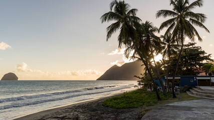 sunset behind the mountains on Diamant Beach in Martinique