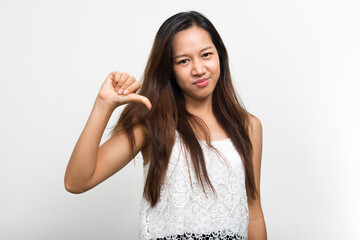 Studio shot of young beautiful Asian woman