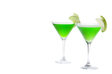 Green appletini cocktail in glass isolated on white background. Copy space