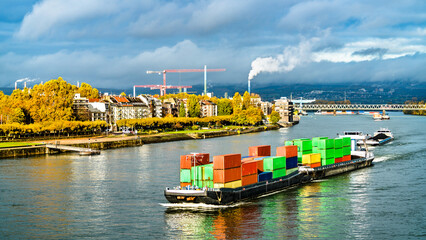 Container ship on the Rhine River in Mainz - Rhineland-Palatinate, Germany - obrazy, fototapety, plakaty