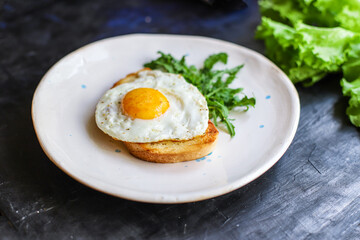 fried egg and toast bread delicious breakfast snack yolk and protein food background top view copy space for text organic eating healthy raw Takeaway