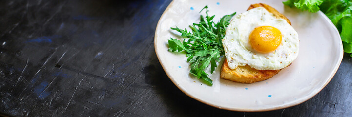 fried egg and toast bread delicious breakfast snack yolk and protein food background top view copy space for text organic eating healthy raw Takeaway