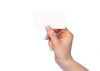 Obraz premium Beautiful female hand holding white business card on white background