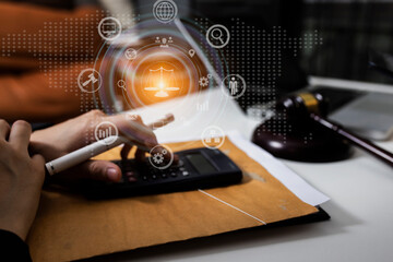 Concepts of Law and Legal services. Lawyer working on digital computer and law interface icons. 