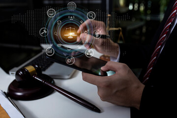 Concepts of Law and Legal services. Lawyer working on digital computer and law interface icons. 