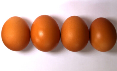 Chicken eggs on a white table