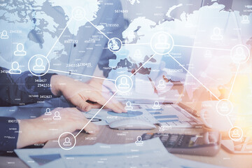 Social network theme hologram with businessman working on computer on background. Multi exposure.