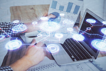 Media network theme hologram with man working on computer on background. Concept of internet communication. Double exposure.