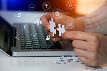 hand pushing a button on a touch screen, hands holding a jigsaw,