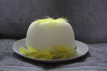 hat with yellow feathers