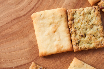Wheat dry biscuits with spices on a wooden table