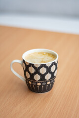Small cup of freshly prepared nes coffee with milk