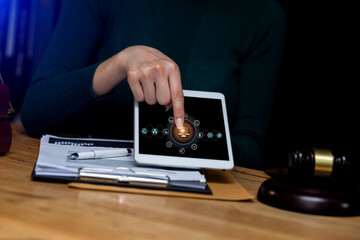 Concepts of Law and Legal services.	Lawyer working with digital tablet computer at office.