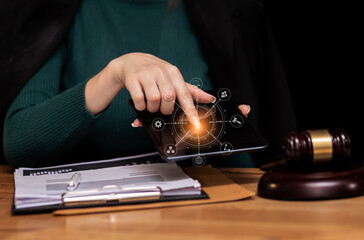 Concepts of Law and Legal services.	Lawyer working with digital tablet computer at office.