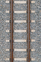 iron railroad on stones, with cement bars. Zenithal symmetrical plane. Bird's eye view.