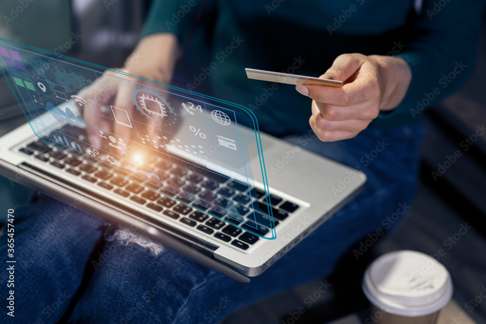 Poster woman hand trader touching on laptop computer with graphs analysis and business banking online.