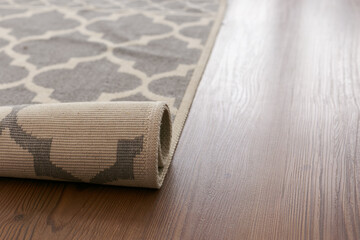 Fototapeta na wymiar Laminated parquet floor. Light wood texture. Modern cozy soft carpet. Warm interior design