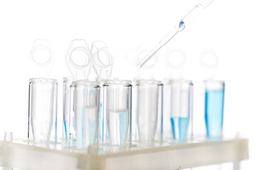 microbiological pipette in the genetic laboratory. study of a virus or vaccination. blue tinted.