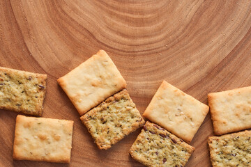 Wheat dry biscuits with spices on a wooden table