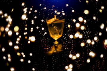 Glass of scotch whiskey on blurred background.