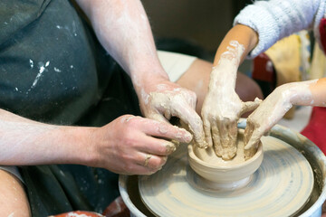 hands of a potter at work