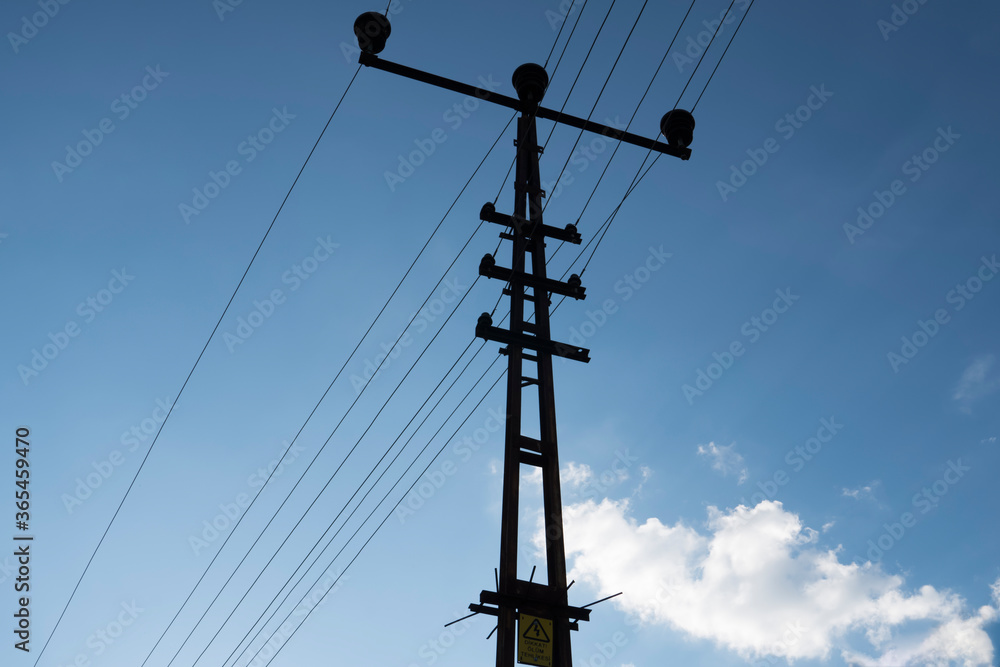 Wall mural electric power transmission lines,blurred background