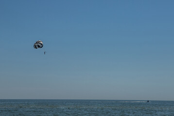 
paragliding in the sky, parachute against the blue sky
