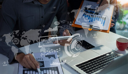 Business teamwork or business partners discussing documents and meeting at the modern office desk. Global Strategy Virtual Icon. Innovation Graphs Interfaces. Workplace strategy concept.