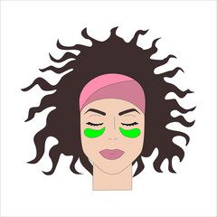 The face of a beautiful girl with  patches around her eyes.