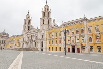 Fototapeta na wymiar Palace of Mafra, Portugal. History landmark in cloud day