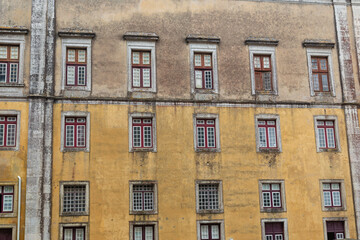 Fototapeta na wymiar Old weathered house wall with a window
