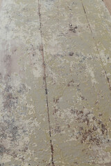 Aged painted solid wood planks laminated backdrop from a vintage soft green table.
