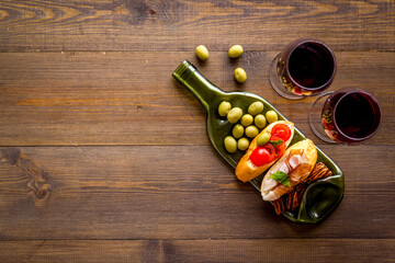 Antipasto and red wine in glasses top-down copy space