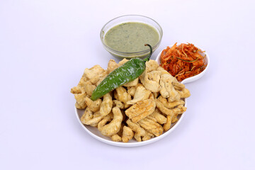 Indian Traditional Spicy food Gathiya, Gathiya Namkeen with green chili and beat salad. Popular tea time snack in Gujarat