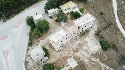 Fototapeten Verlassene Gebäude aerial view of the abandoned and inactive factory buildings near the city  © abu
