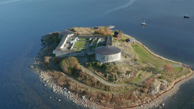 Aerial view of the Steinvikholm Castle. The fort is standing on the island, surrounded by water. Old building is crumbling but still in good shape.