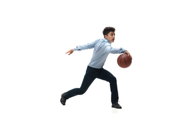 Leader. Man in office clothes playing basketball on white background like professional player, sportsman. Unusual look for businessman in motion, action with ball. Sport, healthy lifestyle, creativity