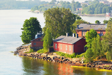 Aerial view of the Lonna island near Helsinki, Finland. Green trees, traditional wooden...