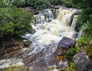 Powerful Popokvil waterfall in a national park in Camboodia