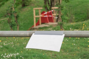 Corona virus quarantine lockdown prohibit playground slide. Barrier tape and blank sign. Covid-19...