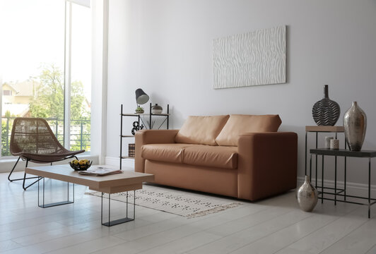 Modern living room interior with stylish leather sofa