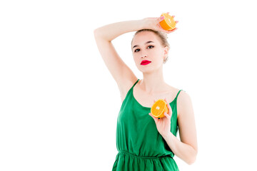 Emotional portrait of a girl with orange in hands on an isolated white background. The concept of a healthy diet, healthy lifestyle and vegetarianism