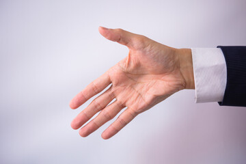 Obraz premium 握手を求める日本人の手