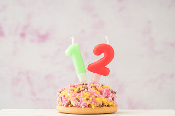 cupcake with number six shaped candle for birthday