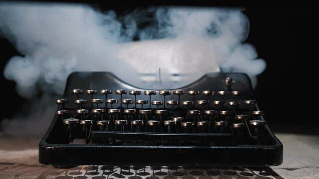Script writer prints the text on a typewriter