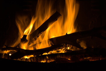 Fireplace fire with flames and black background